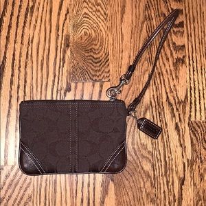 Brown canvas Coach wristlet